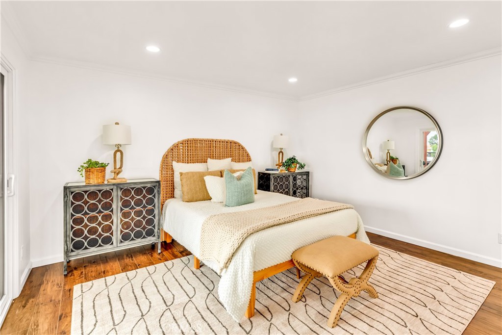 1724 El Rey Road San Pedro, CA 90732 - Photo 26 of 51 a bedroom with a bed and a chandelier