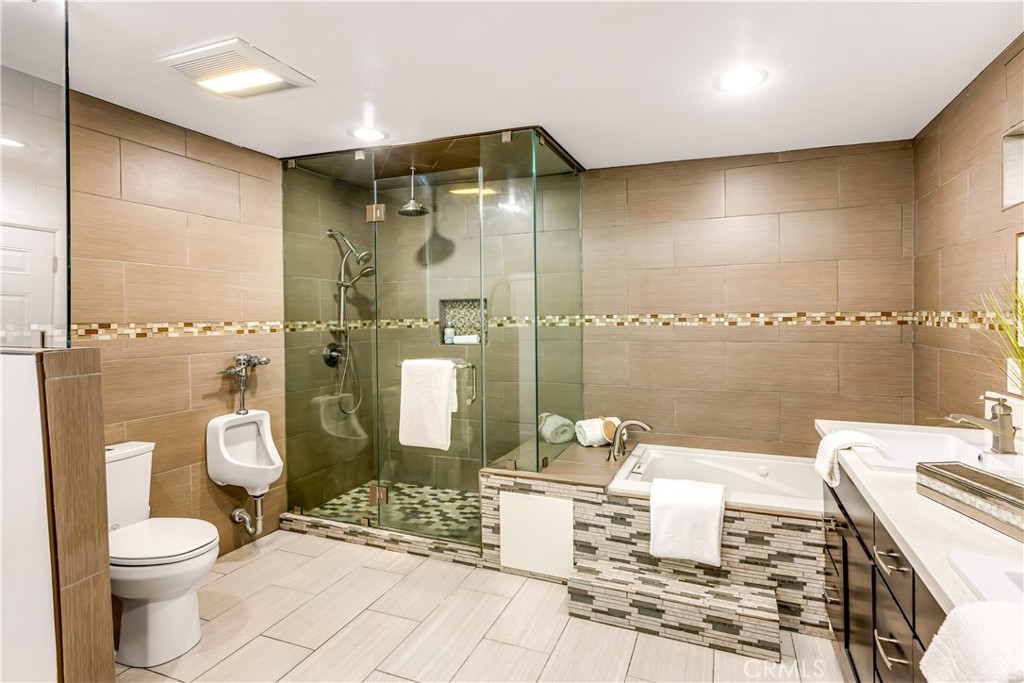 1724 El Rey Road San Pedro, CA 90732 - Photo 31 of 51 a bathroom with a toilet a sink and shower