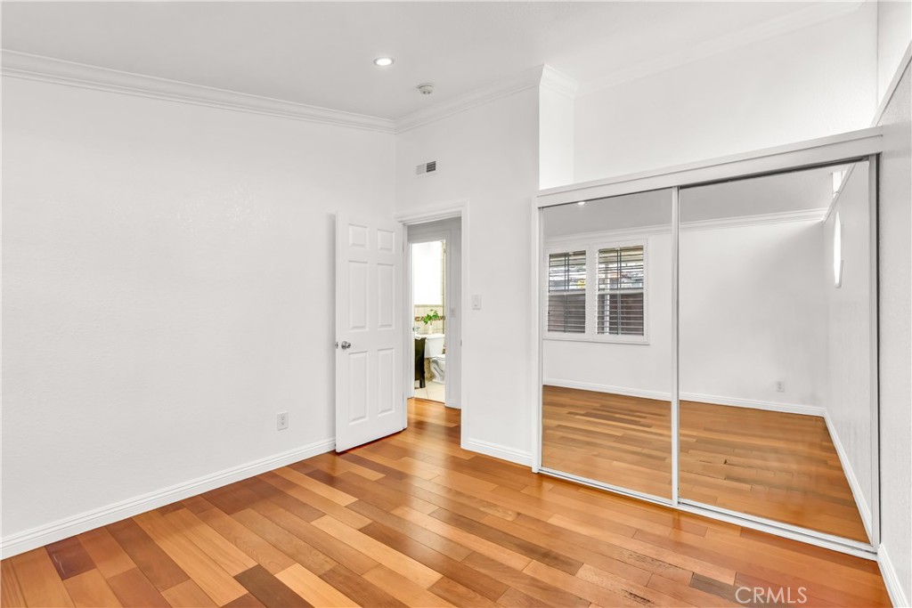 1724 El Rey Road San Pedro, CA 90732 - Photo 37 of 51 a view of an empty room with wooden floor and a window