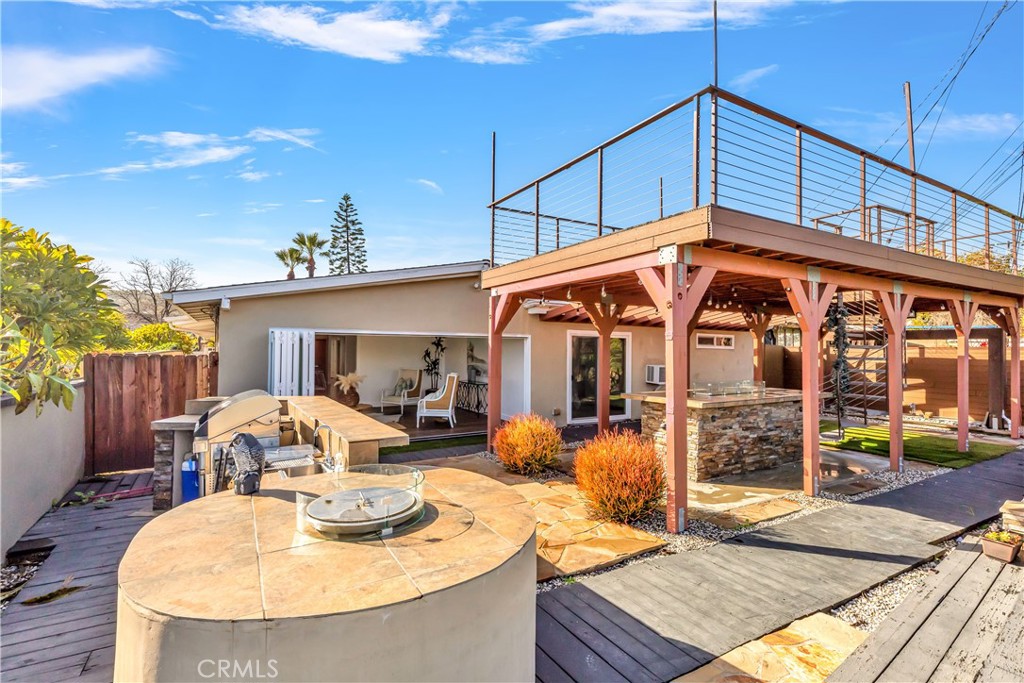 1724 El Rey Road San Pedro, CA 90732 - Photo 45 of 51 a backyard of a house with yard fire pit and outdoor seating