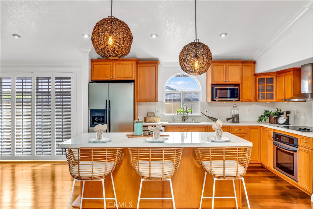 1724 El Rey Road San Pedro, CA 90732 - Photo 10 of 51 a very nice looking kitchen with granite countertop a stove a sink a dining table and chairs