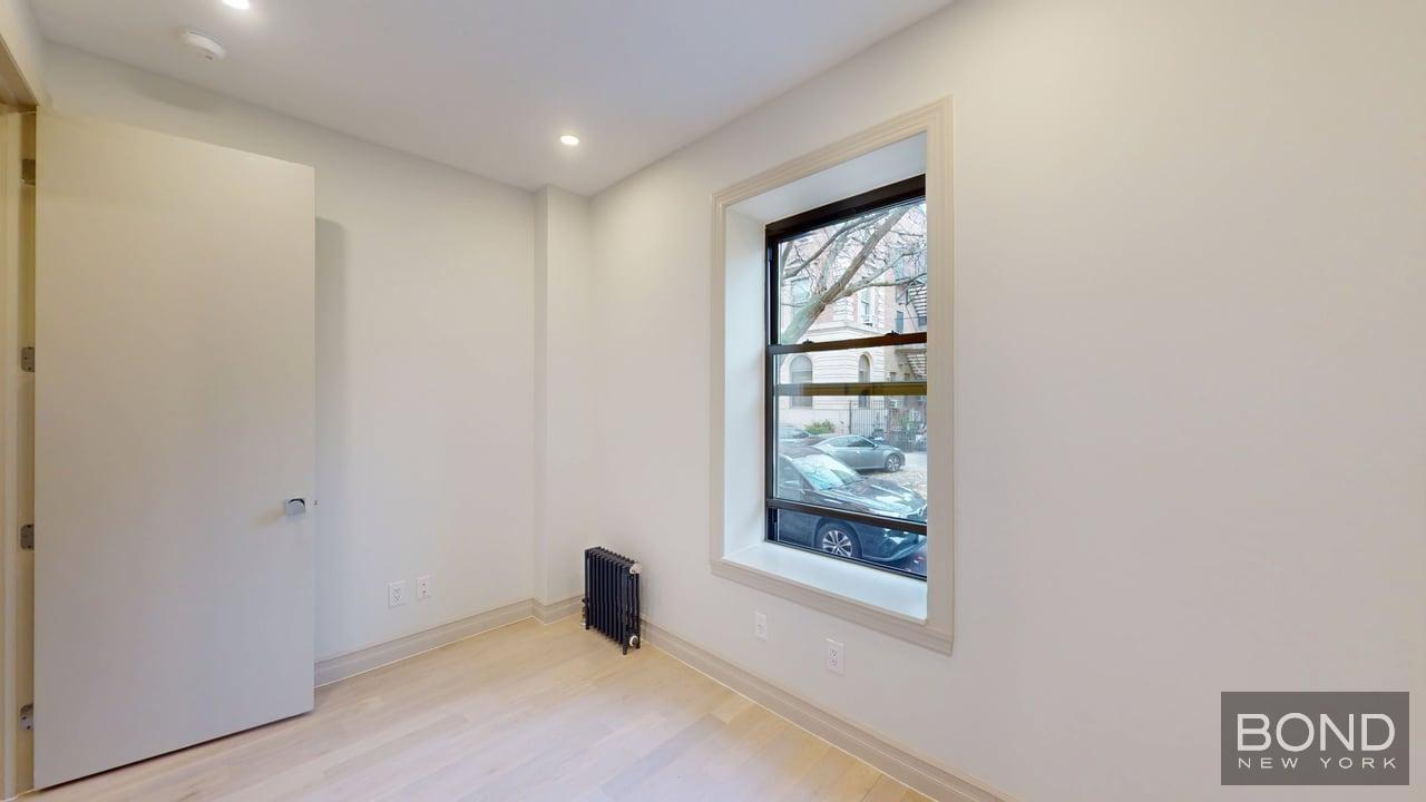 1031 Lorimer Street, Unit 2 Brooklyn, NY 11222 - Photo 11 of 15 an empty room with windows