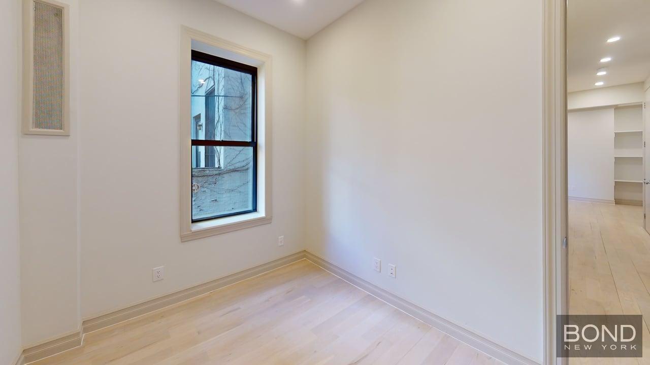 1031 Lorimer Street, Unit 2 Brooklyn, NY 11222 - Photo 15 of 15 an empty room with windows
