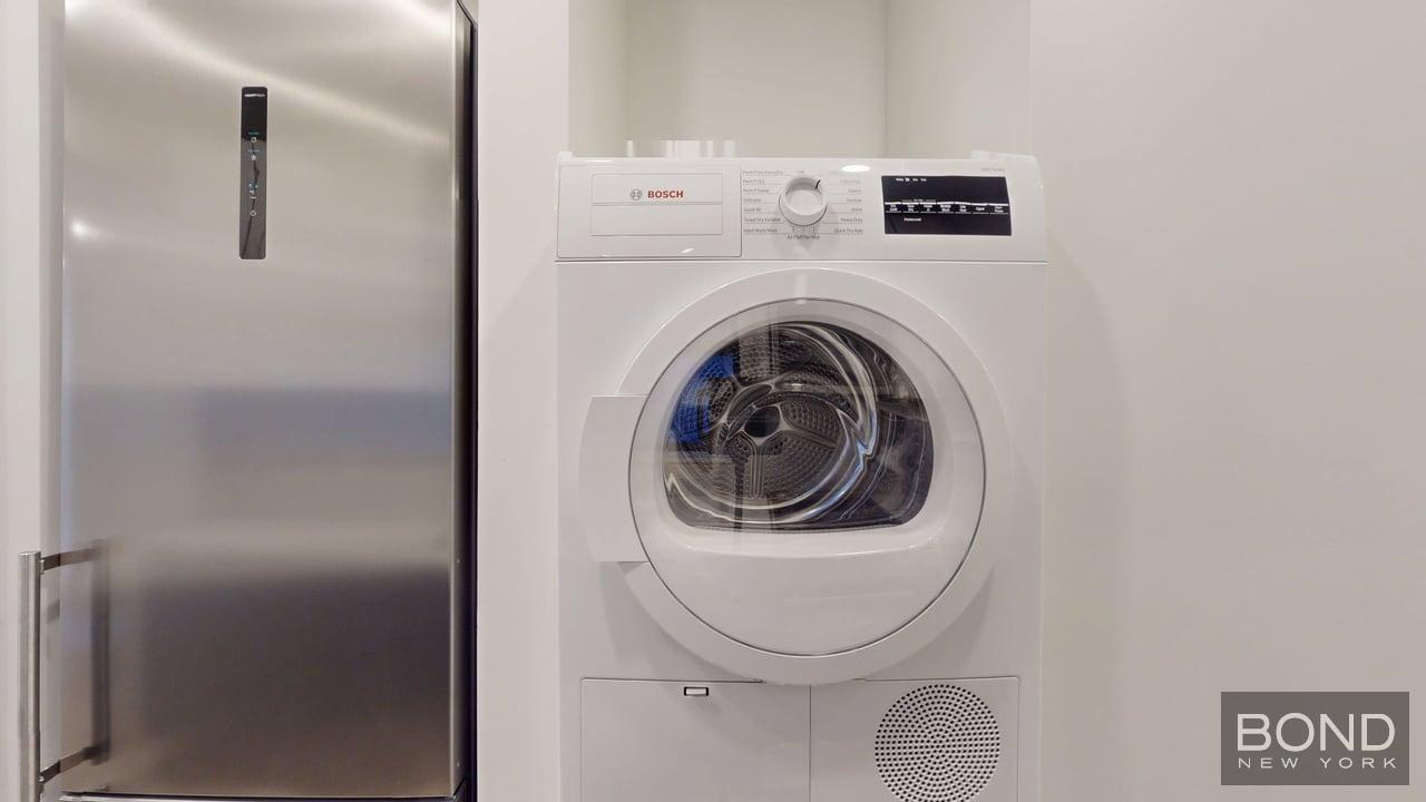 1031 Lorimer Street, Unit 2 Brooklyn, NY 11222 - Photo 7 of 15 a close up view of a washer and dryer
