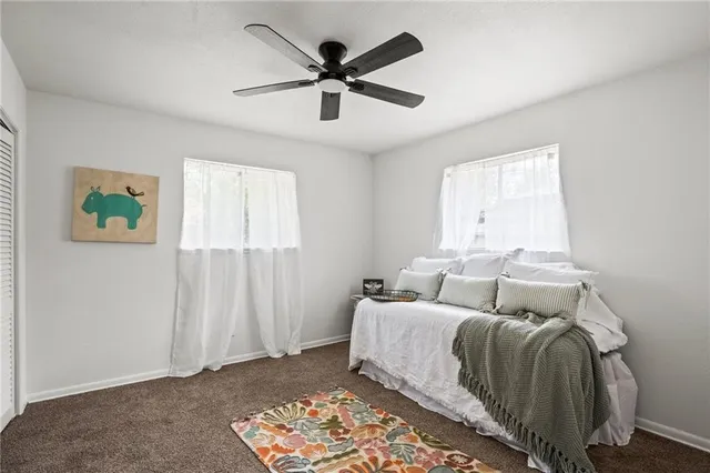 a bed room with a bed and a window