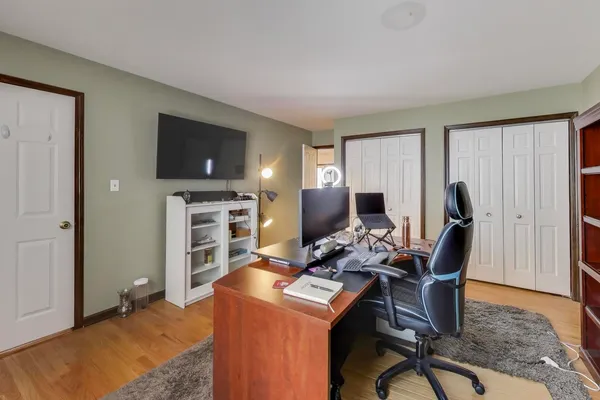 a workspace with furniture and a flat screen tv