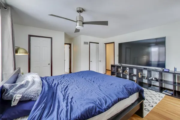 a spacious bathroom with a granite countertop sink toilet and shower
