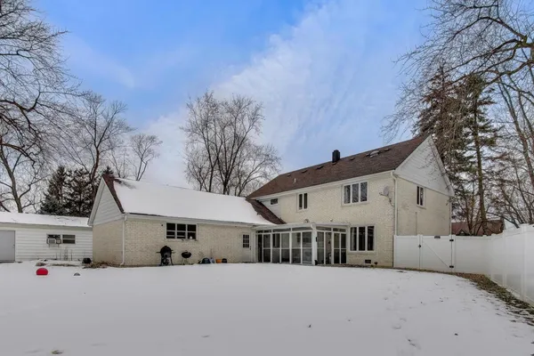 a view of a white house with a yard