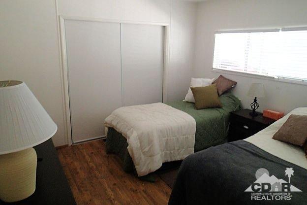 52791 Pine Cove Road, Unit 8 Idyllwild, CA 92549 - Photo 14 of 15 a bedroom with two beds and a window
