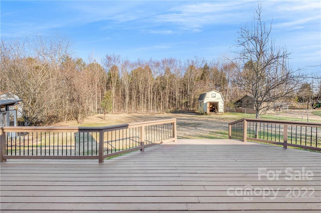 13809 Mayes Road Huntersville, NC 28078 - Photo 11 of 15 a view of a balcony with trees