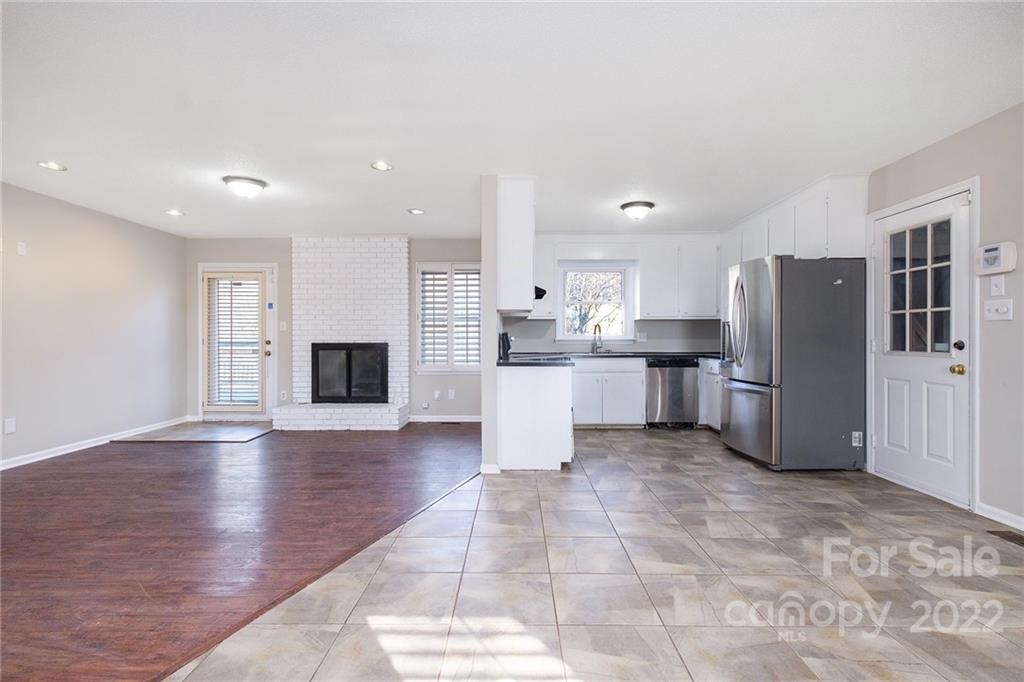 13809 Mayes Road Huntersville, NC 28078 - Photo 3 of 15 a large kitchen with stainless steel appliances granite countertop a refrigerator and a stove top oven