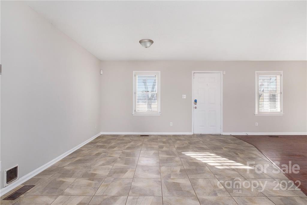 13809 Mayes Road Huntersville, NC 28078 - Photo 8 of 15 a view of a big room with windows