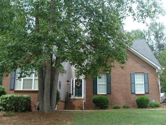 109 Inman Court Macon, GA 31220 - Photo 1 of 1 a front view of a house with a yard and a garage