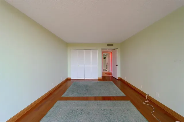 a bathroom with a toilet and a shower curtain