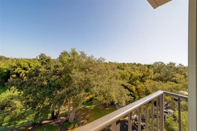 a view of swimming pool with outdoor seating and lake