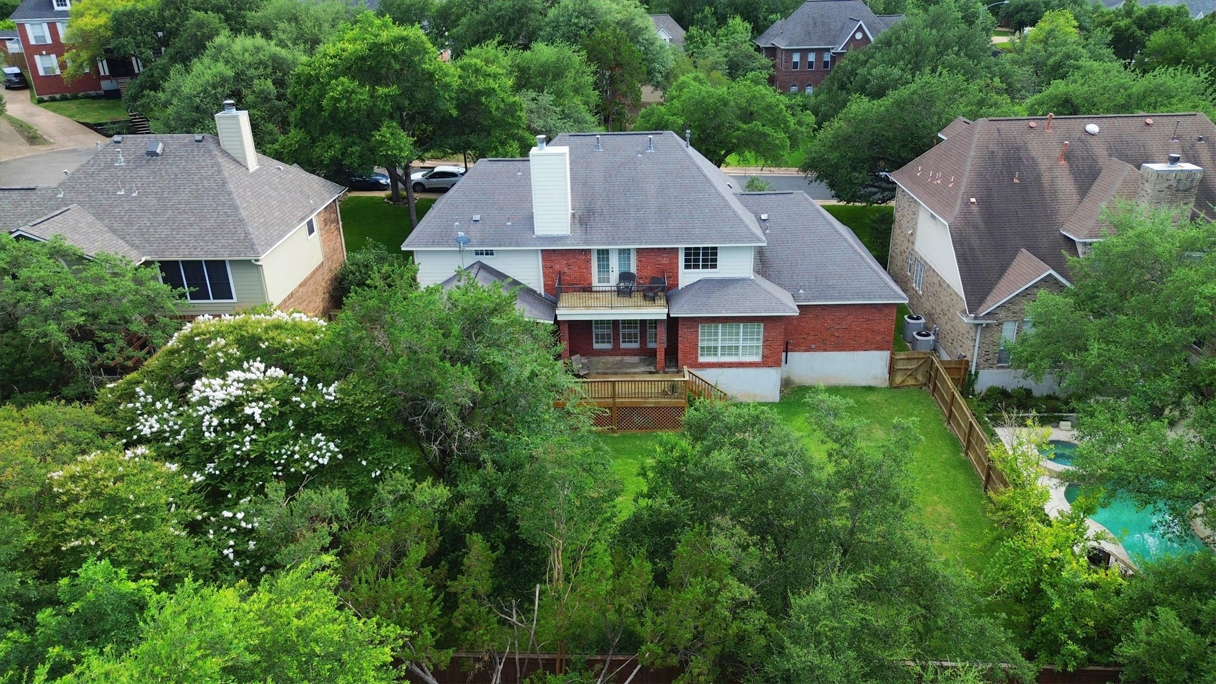 6008 Tributary Ridge Court Austin, TX 78759 - Photo 32 of 36 A private backyard oasis with multiple decks.