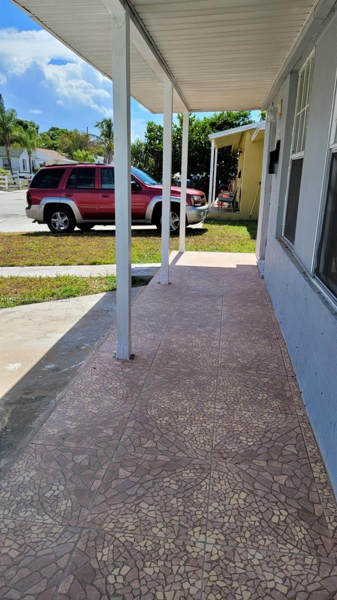 935 West 5th Street, Unit 935 Riviera Beach, FL 33404 - Photo 2 of 11 a view of a house with backyard patio and swimming pool