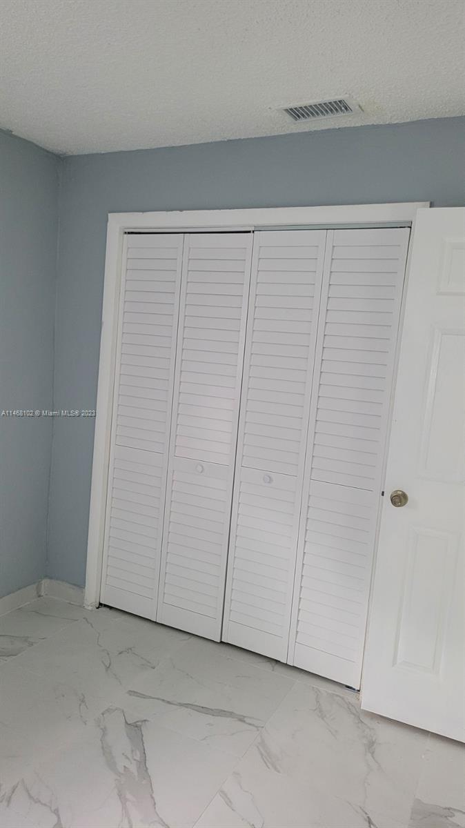 935 West 5th Street, Unit 935 Riviera Beach, FL 33404 - Photo 6 of 11 a view of an empty room