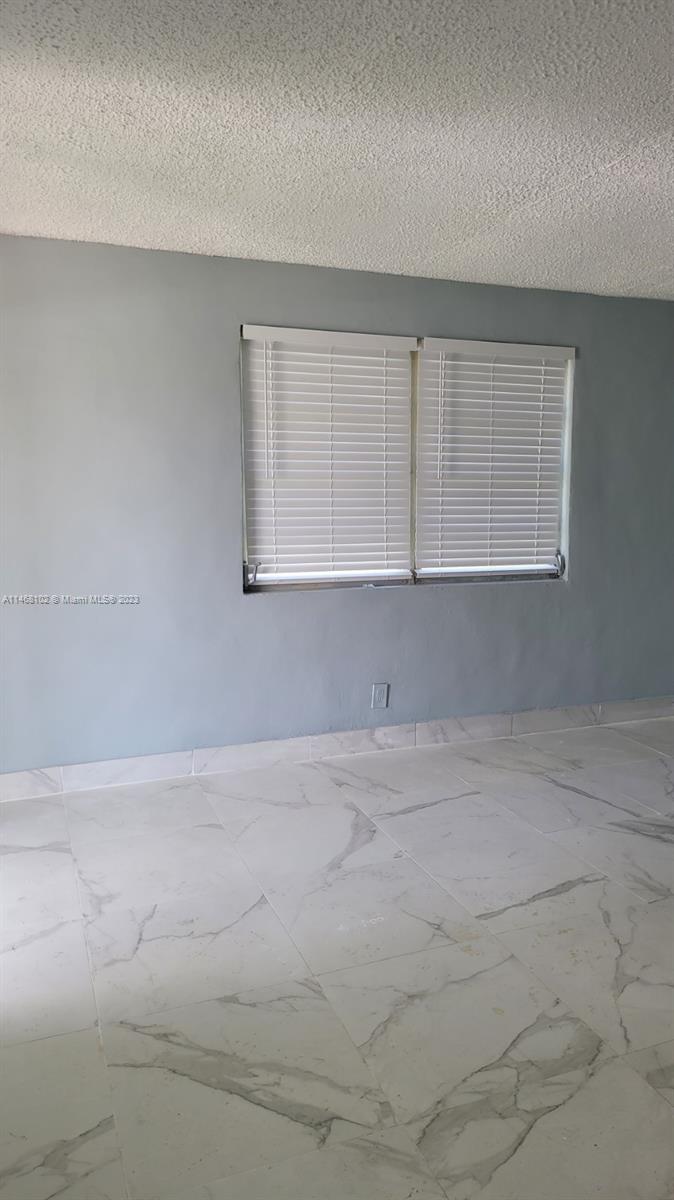 935 West 5th Street, Unit 935 Riviera Beach, FL 33404 - Photo 7 of 11 a view of an empty room