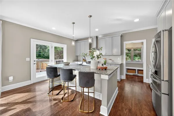 a view of a dining room with furniture window and wooden floor