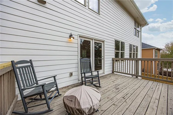 a view of a wooden chairs on the deck