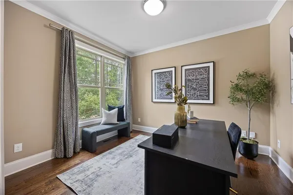 a view of a livingroom with a table and workspace
