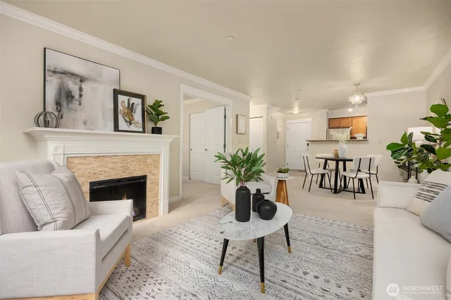 a living room with furniture fireplace and potted plant