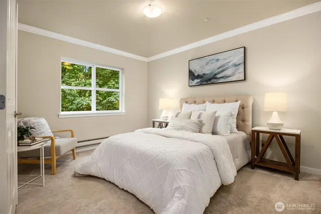 a bedroom with bed and a window