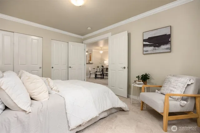 a spacious bedroom with a bed and furniture