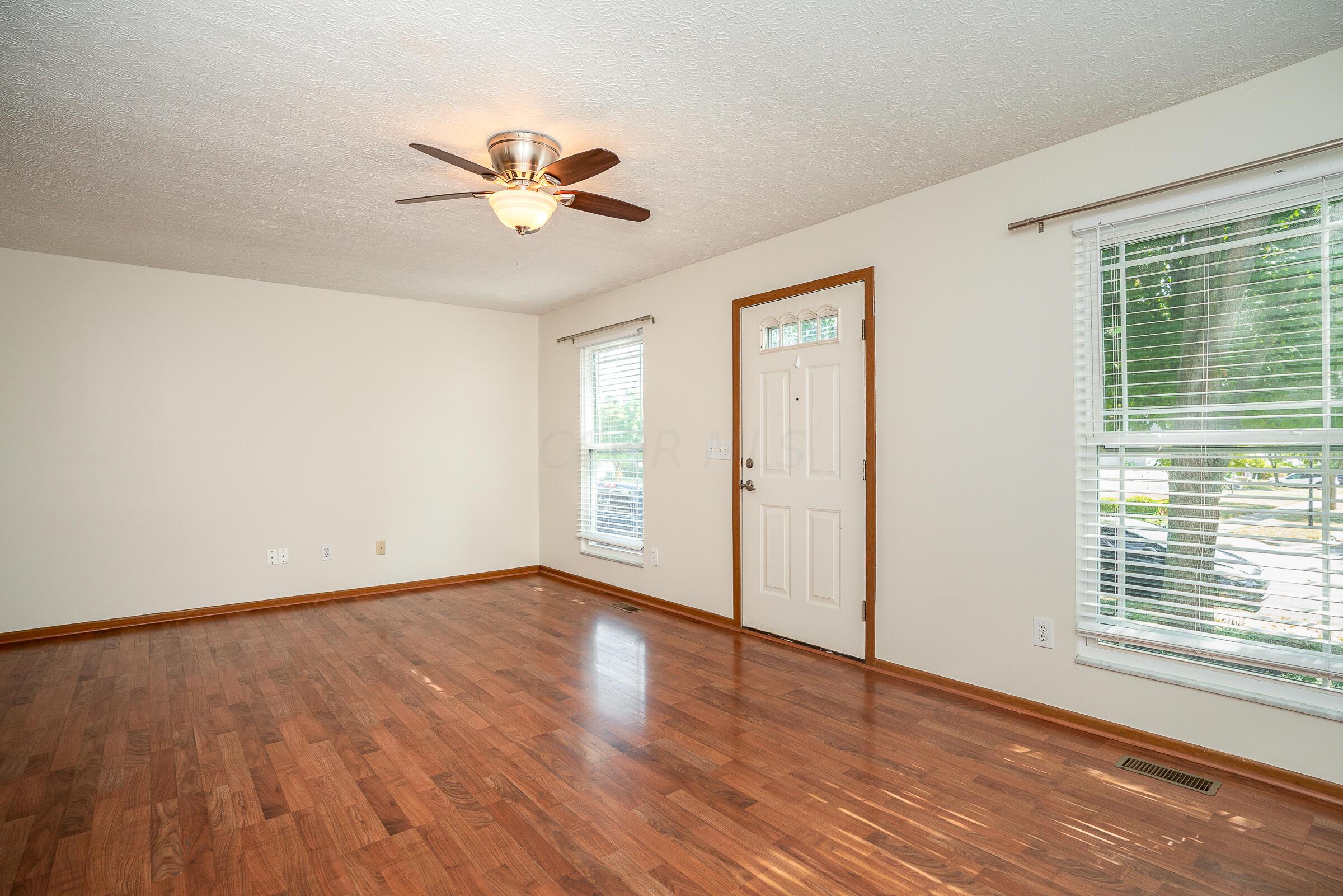 2135 Tonda Lane Grove City, OH 43123 - Photo 4 of 37 Step inside to a freshly painted interior with replacement windows throughout