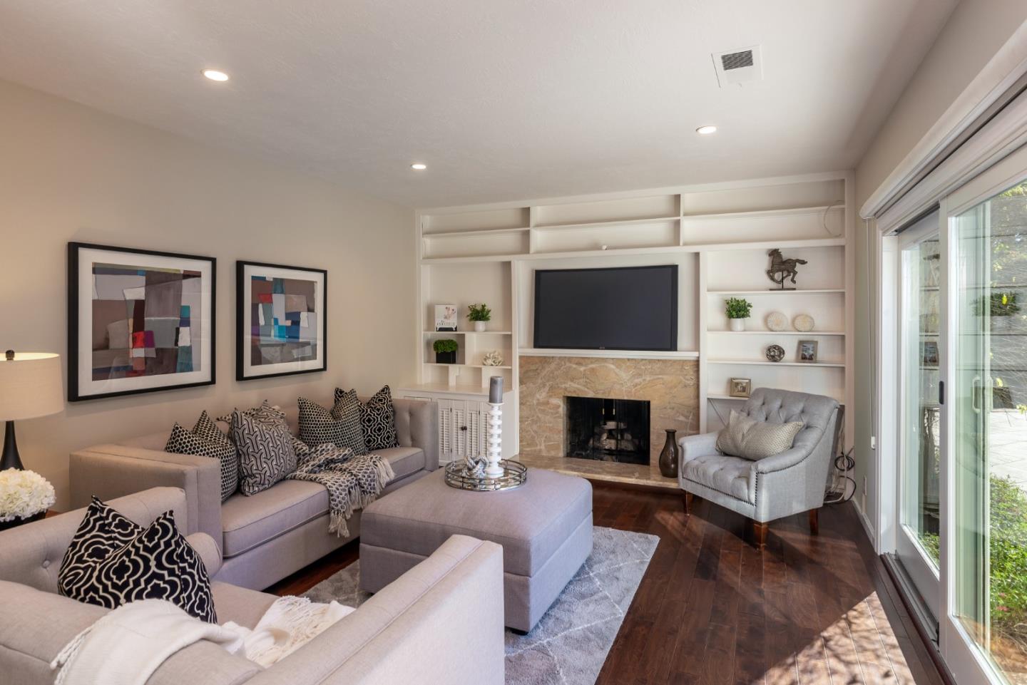 505 Preston Drive Mountain View, CA 94040 - Photo 10 of 23 a living room with furniture a flat screen tv and a fireplace