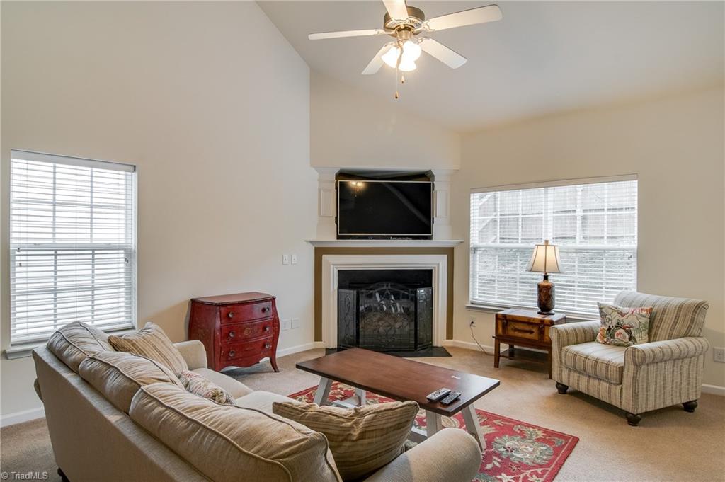 725 Spinning Wheel Point High Point, NC 27265 - Photo 6 of 27 A grand great room with a regal fireplace and surround.