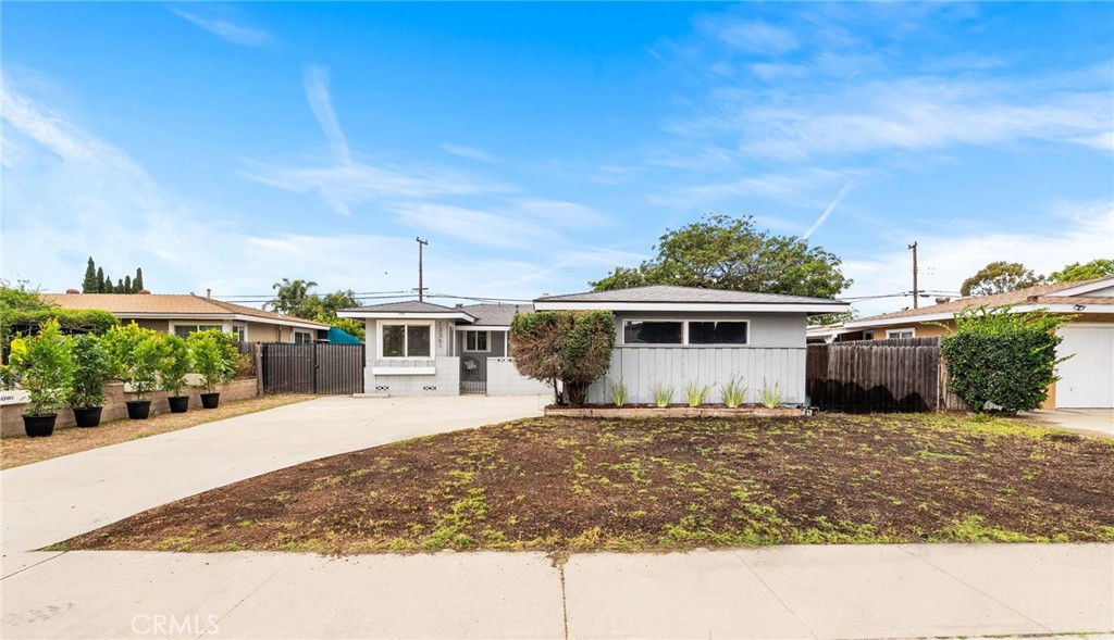 13361 Roxey Drive Garden Grove, CA 92843 - Photo 26 of 31 a view of a house with a yard