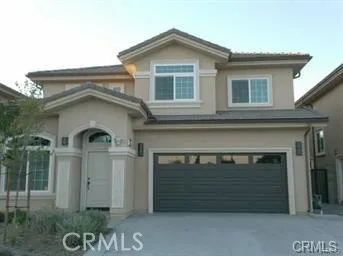 a front view of a house with a garage