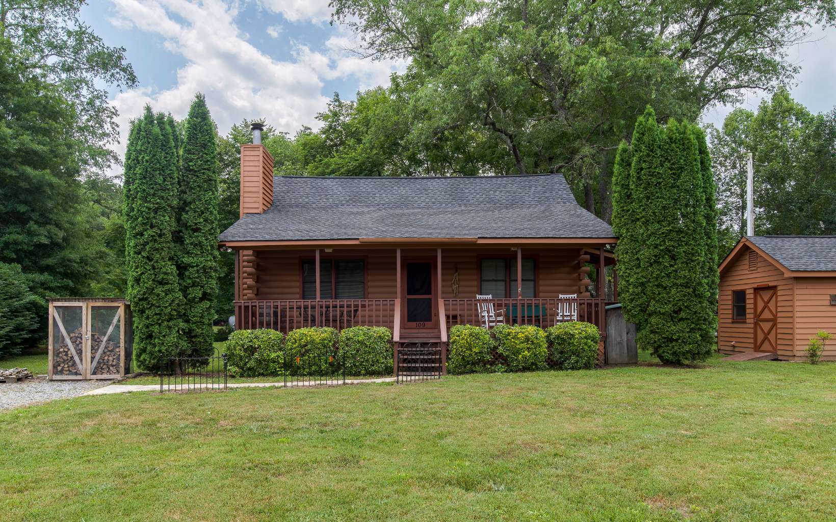 109 Quail Run Blue Ridge, GA 30513 - Photo 1 of 1 a view of a house with backyard and garden