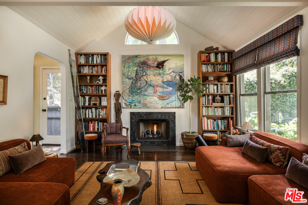 1452 Westerly Terrace Los Angeles, CA 90026 - Photo 1 of 39 a living room with furniture fireplace and a large window