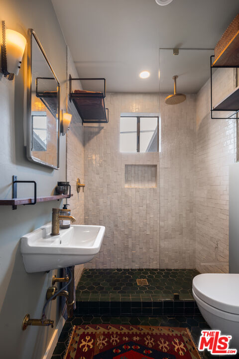 1452 Westerly Terrace Los Angeles, CA 90026 - Photo 12 of 39 a bathroom with a sink toilet and mirror