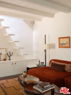 a bedroom with a bed and a cabinets