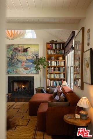 a living room with a couch and a fireplace