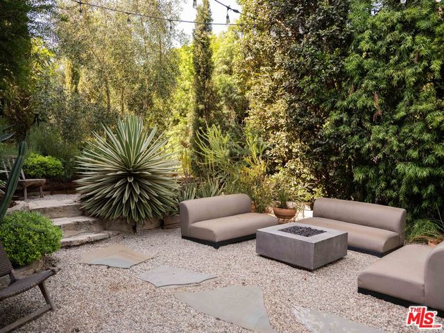 a view of outdoor seating with furniture and plants