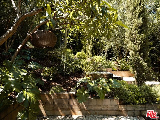 a backyard of a house with outdoor seating