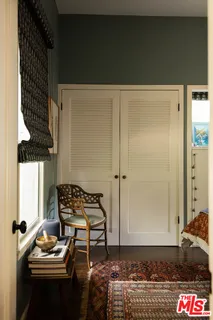 a view of wooden floor and chairs in a room