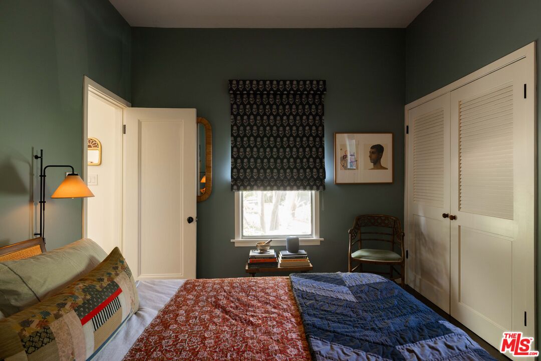 1452 Westerly Terrace Los Angeles, CA 90026 - Photo 8 of 39 a bedroom with a bed and wooden floor