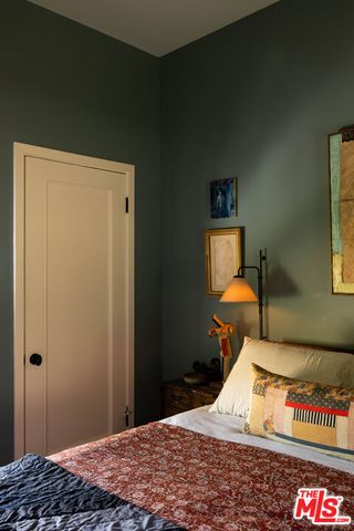 a bedroom with a bed and a table in it