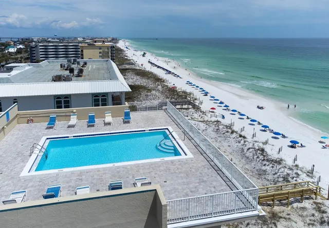 a view of a pool table and chairs in the terrace
