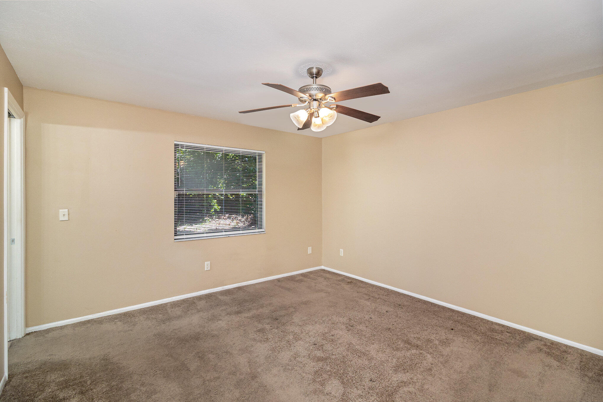 635 Croton Road Melbourne, FL 32935 - Photo 16 of 22 a view of an empty room with a window