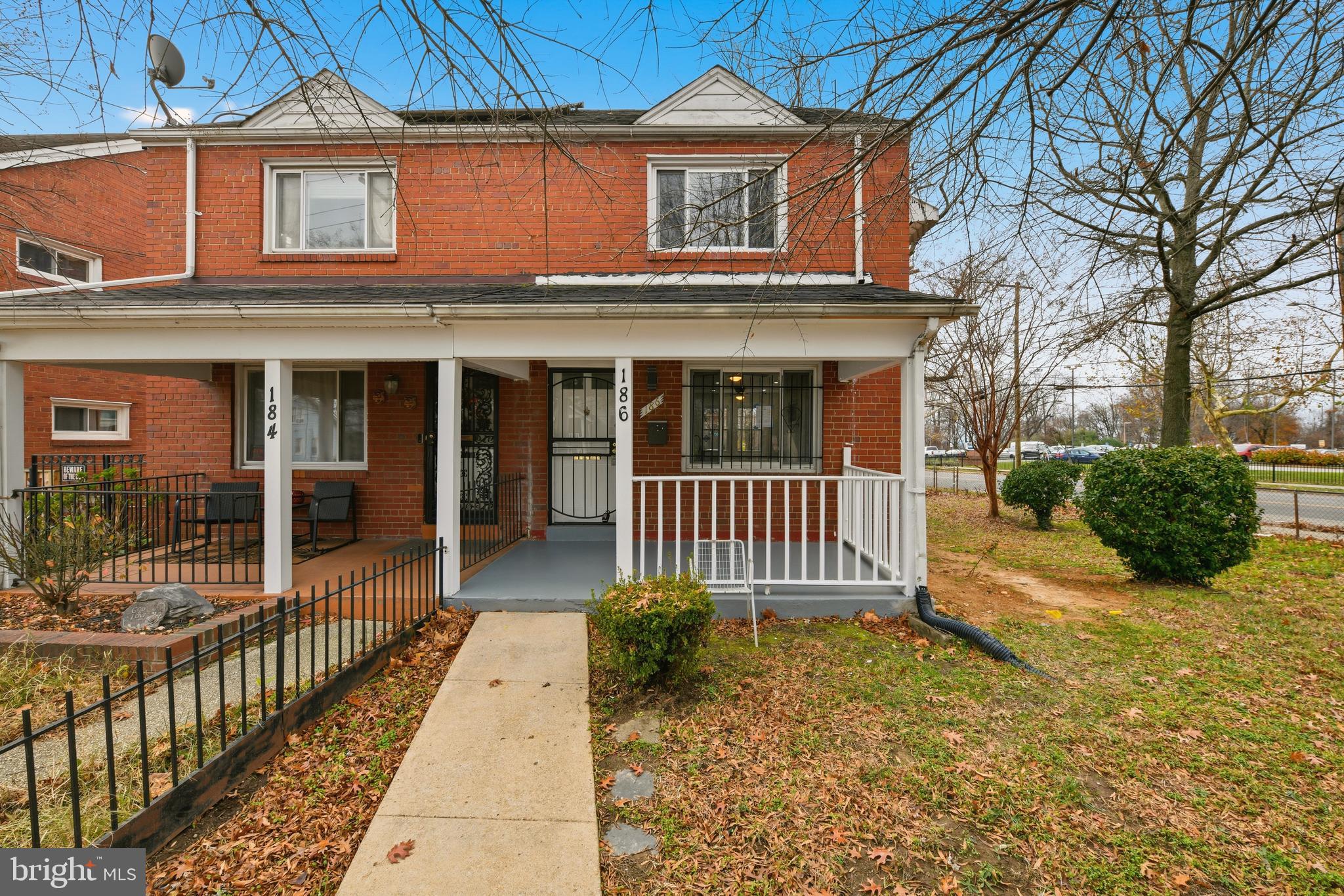 a view of a house with a porch and furniture