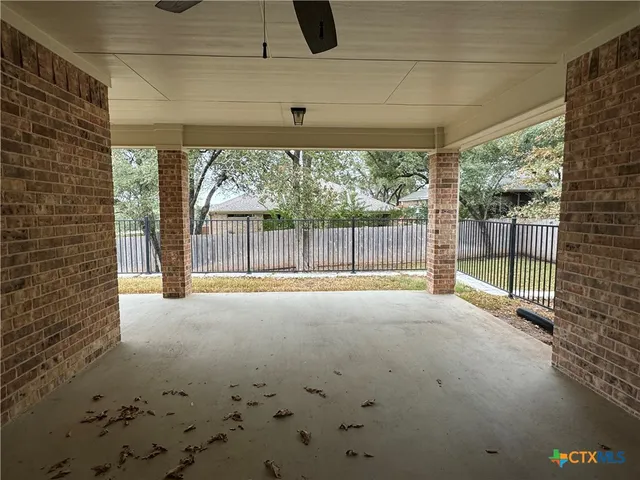 a view of backyard with porch
