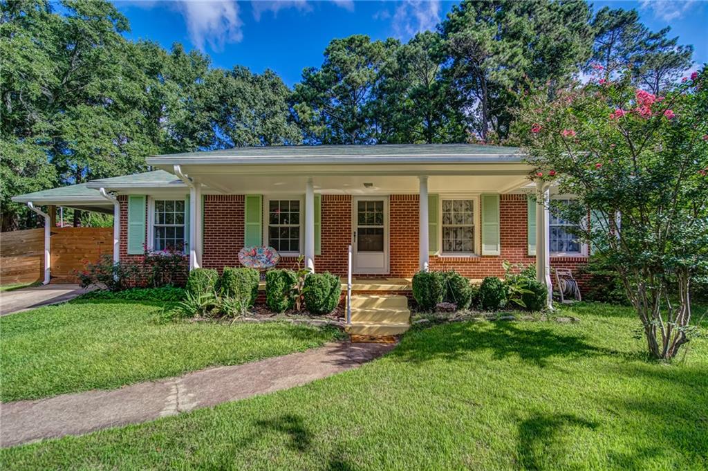 4114 Brownlee Drive Tucker, GA 30084 - Photo 1 of 1 a view of a house with a yard and potted plants