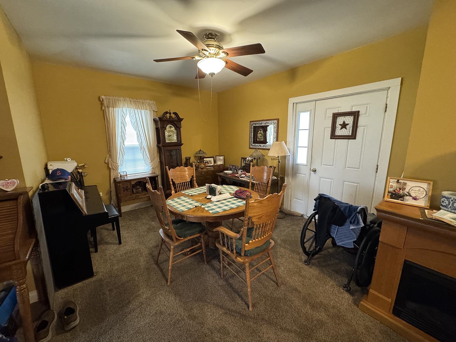 27375 Highway 40 Chadwick, IL 61014 - Photo 11 of 39 a living room with furniture a chandelier fan and a window